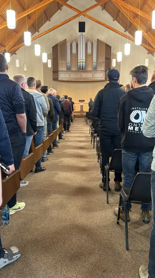 Men standing together during the 2024 conference