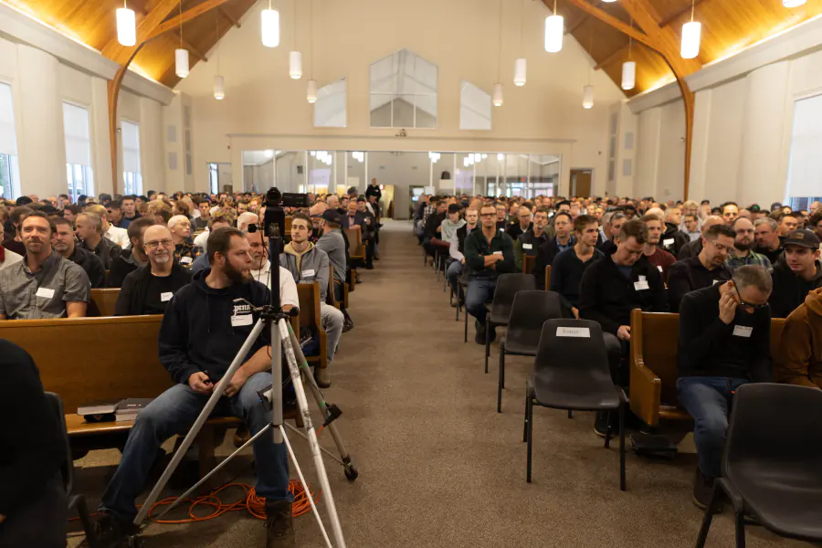 Attendees seated in the auditorium before a 2025 Strive session